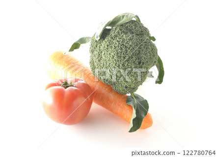 Tomatoes, carrots and broccoli photographed on a white background 122780764