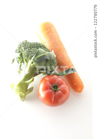 Tomatoes, carrots and broccoli photographed on a white background Tomatoes, carrots and broccoli photographed on a white background 122780776