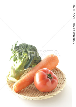 Tomatoes, carrots and broccoli photographed on a white background Tomatoes, carrots and broccoli photographed on a white background 122780783