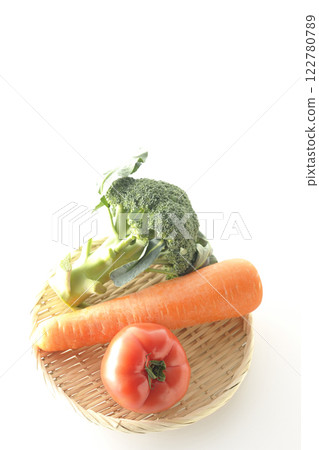 Tomatoes, carrots and broccoli photographed on a white background 122780789