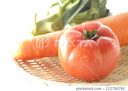 Tomatoes, carrots and broccoli photographed on a white background Tomatoes, carrots and broccoli photographed on a white background 122780792
