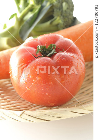 Tomatoes, carrots and broccoli photographed on a white background 122780793