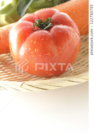 Tomatoes, carrots and broccoli photographed on a white background 122780795