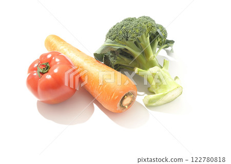 Tomatoes, carrots and broccoli photographed on a white background Tomatoes, carrots and broccoli photographed on a white background 122780818