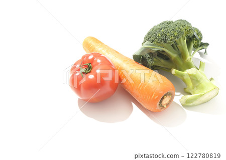 Tomatoes, carrots and broccoli photographed on a white background Tomatoes, carrots and broccoli photographed on a white background 122780819