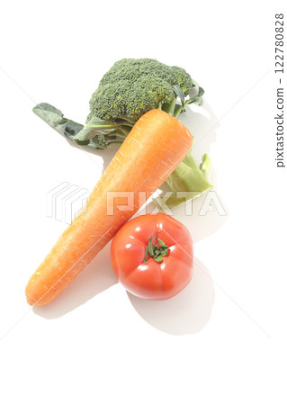 Tomatoes, carrots and broccoli photographed on a white background Tomatoes, carrots and broccoli photographed on a white background 122780828