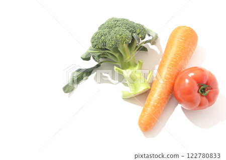 Tomatoes, carrots and broccoli photographed on a white background Tomatoes, carrots and broccoli photographed on a white background 122780833