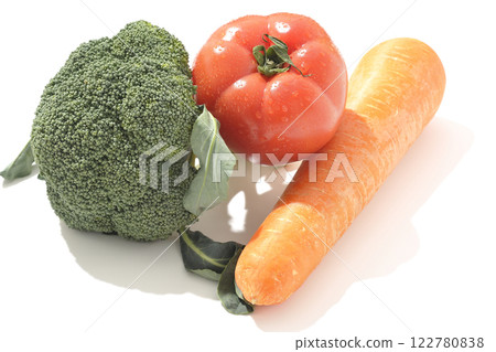 Tomatoes, carrots and broccoli photographed on a white background Tomatoes, carrots and broccoli photographed on a white background 122780838