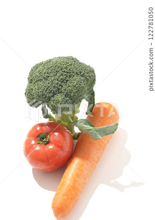 Tomatoes, carrots and broccoli photographed on a white background 122781050