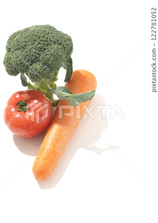 Tomatoes, carrots and broccoli photographed on a white background Tomatoes, carrots and broccoli photographed on a white background 122781052