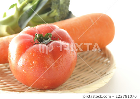 Tomatoes, carrots and broccoli photographed on a white background 122781076