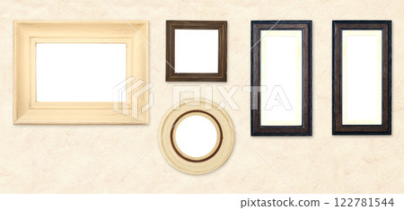 Horizontal banner with blank picture frames hanging on stucco wall. Empty photo frame set on wall background. Mock up poster frame template for decor room. Retro Interior design. Copy space for text Horizontal banner with blank picture frames hanging on stucco wall. Empty photo frame set on wall background. Mock up poster frame template for decor room. Retro Interior design. Copy space for text 122781544
