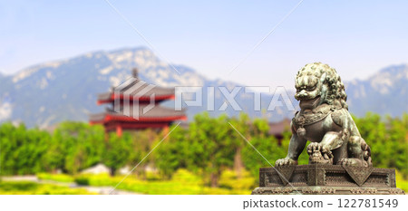 Horizontal background with pavilion, mountain and ancient chinese lion statue. Bronze guardian lion and picturesque landscape, China. Topic of vacation, travel, trip abroad on vacation, cruises, tours 122781549