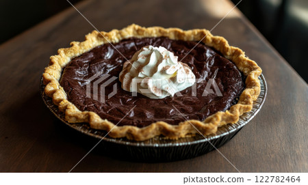 Delicious chocolate pie with flaky crust and whipped cream topping 122782464