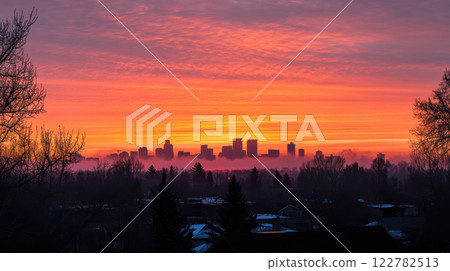 Stunning city skyline at sunrise with vibrant colors and silhouettes 122782513