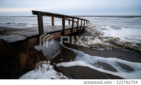bridge partially collapsed due to rising tides and strong waves 122782754