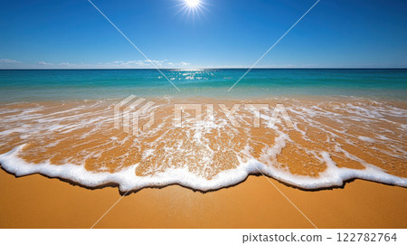 bright beach scene with golden sand and turquoise water under sunny sky 122782764