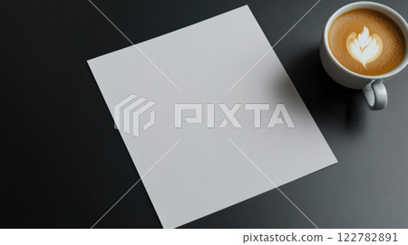 blank sheet of paper on table with cup of coffee, inviting creativity blank sheet of paper on table with cup of coffee, inviting creativity 122782891