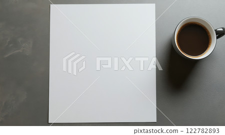 blank sheet of paper beside cup of coffee on table blank sheet of paper beside cup of coffee on table 122782893
