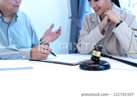 Lawyer and client are listening and giving advice about a legal case 122783307