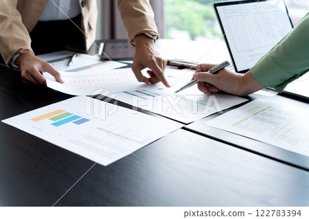 In Marketing brainstrom meeting The team is standing and pointing 122783394