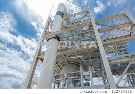 Modern industrial structure showcasing precision engineering and innovative design against a clear sky 122784186