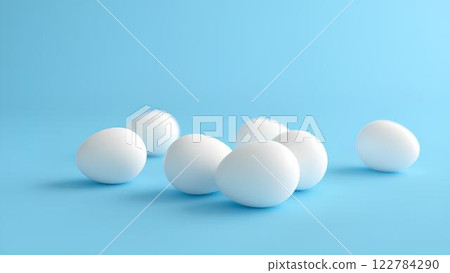 White eggs isolated on light blue background with space for text, lying horizontally. 122784290