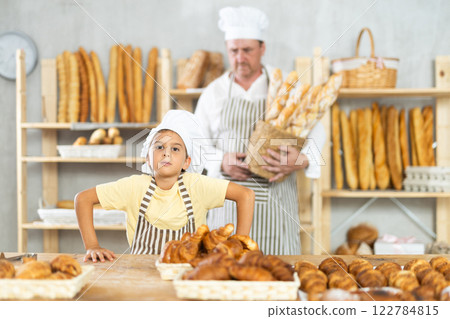 Father and little daughter - selling bread and various baguettes for sale Father and little daughter - selling bread and various baguettes for sale 122784815
