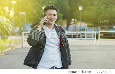 Man calling on the phone, young man calling on cell phone, latin guy calling on the phone Man calling on the phone, young man calling on cell phone, latin guy calling on the phone 122784920