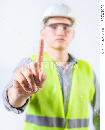 Young engineer counting number one isolated. Male engineer showing number one isolated Young engineer counting number one isolated. Male engineer showing number one isolated 122785062