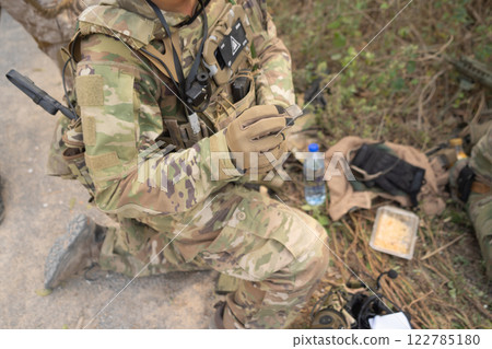 Team of U.S. Army marine corps soldier military war with gun weapon participating and preparing to attack the enemy in Thailand during exercise Cobra Gold training in battle. Combat force. 122785180
