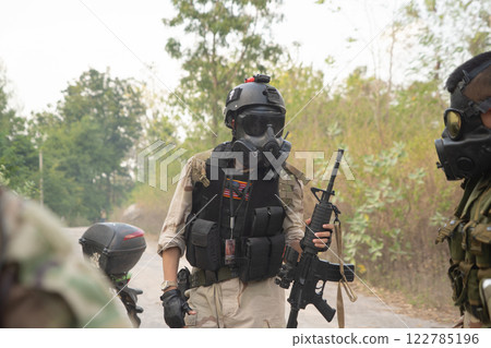 Team of U.S. Army marine corps soldier military war with gun weapon participating and preparing to attack the enemy in Thailand during exercise Cobra Gold training in battle. Combat force. 122785196