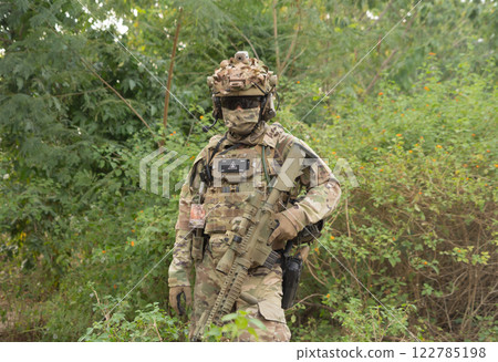 Team of U.S. Army marine corps soldier military war with gun weapon participating and preparing to attack the enemy in Thailand during exercise Cobra Gold training in battle. Combat force. 122785198