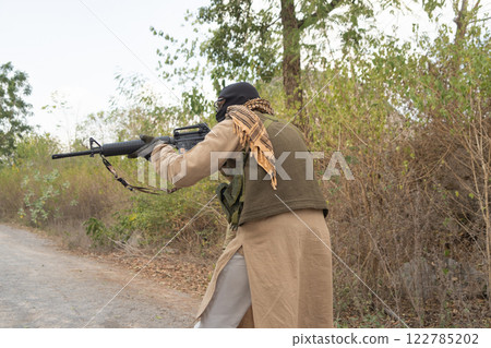 Team of U.S. Army marine corps soldier military war with gun weapon participating and preparing to attack the enemy in Thailand during exercise Cobra Gold training in battle. Combat force. Team of U.S. Army marine corps soldier military war with gun weapon participating and preparing to attack the enemy in Thailand during exercise Cobra Gold training in battle. Combat force. 122785202