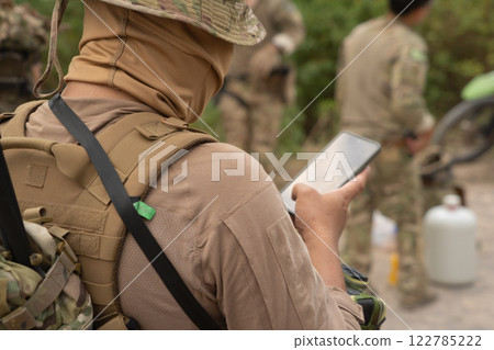 Team of U.S. Army marine corps soldier military war with gun weapon participating and preparing to attack the enemy in Thailand during exercise Cobra Gold training in battle. Combat force. Team of U.S. Army marine corps soldier military war with gun weapon participating and preparing to attack the enemy in Thailand during exercise Cobra Gold training in battle. Combat force. 122785222