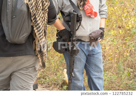 Team of U.S. Army marine corps soldier military war with gun weapon participating and preparing to attack the enemy in Thailand during exercise Cobra Gold training in battle. Combat force. 122785232