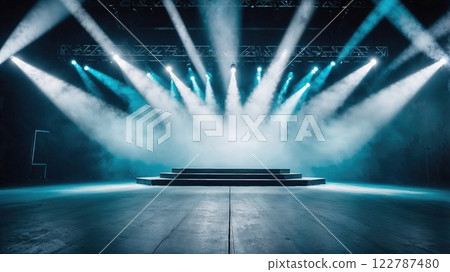 Dramatic stage illuminated by powerful beams of blue and white lights, creating an atmospheric scene perfect for performances, concerts, or theatrical productions 122787480