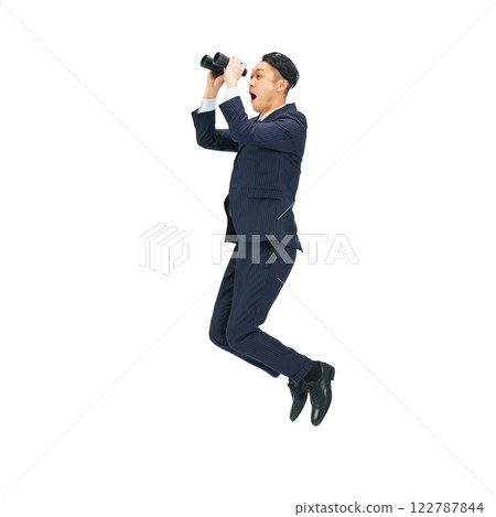 Middle-aged male business person jumping with binoculars. Full-body photo PNG with transparent background precisely cut out by hand. 122787844