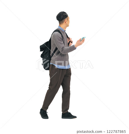 Middle-aged man in casual wear walking while looking at his smartphone. Full-body photo PNG with transparent background precisely cut out by hand 122787865
