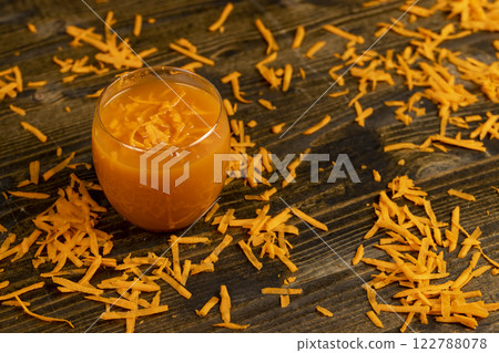 grated orange carrots and fresh carrot juice 122788078