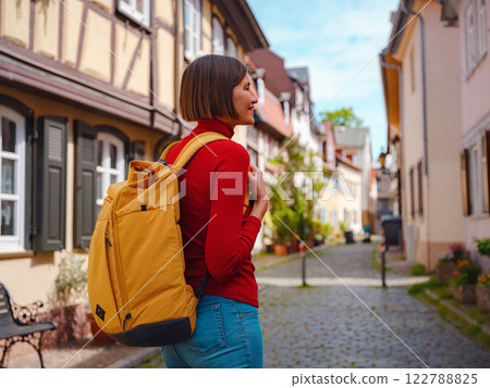 Tourist woman enjoys historic charm of Hochst near Frankfurt Tourist woman enjoys historic charm of Hochst near Frankfurt 122788825