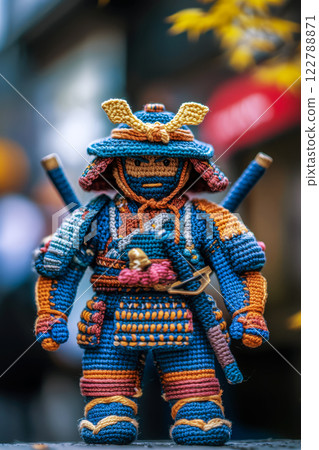 Vertical postcard with a figurine of a samurai crocheted from wool, handmade toys Vertical postcard with a figurine of a samurai crocheted from wool, handmade toys 122788871