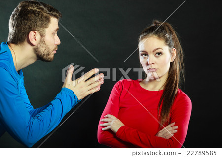 Regretful man husband apologizing upset woman wife 122789585