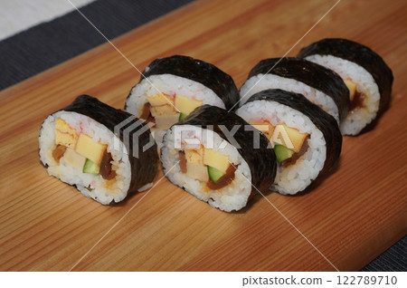 Homemade sushi roll on wood board. Japanese food. 122789710