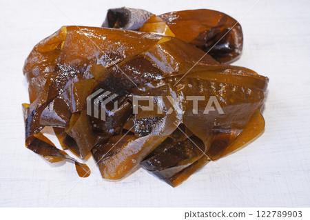 Fresh seaweed wakame on wood background. Japanese food. Fresh seaweed wakame on wood background. Japanese food. 122789903
