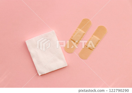 Bandage and cotton wool (pink background) 122790290