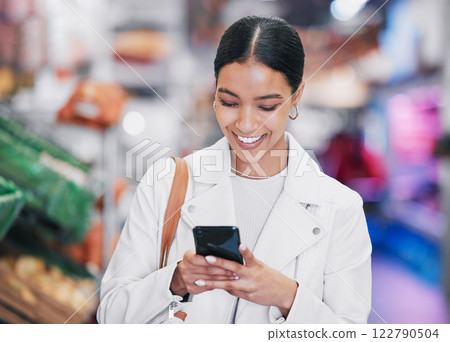 Supermarket, phone or woman with smile in food store doing research, ecommerce or online shopping on healthy product. Happy customer shopping for grocery retail cooking stock on sale with fintech app 122790504