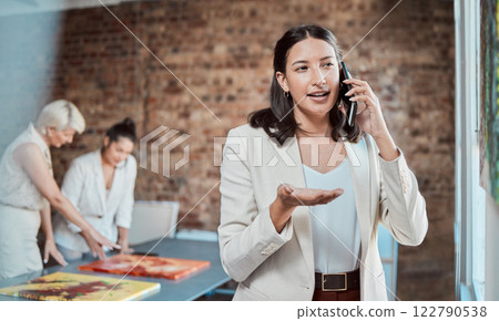 Painting, artistic and call with a woman art gallery manager talking on a phone in a studio with her team in the background. Paint, creative and collaboration with a team selling artwork in an office Painting, artistic and call with a woman art gallery manager talking on a phone in a studio with her team in the background. Paint, creative and collaboration with a team selling artwork in an office 122790538