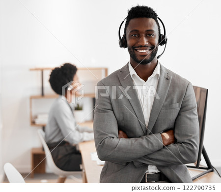 Call center, customer service and crm consultant wearing headset and looking happy in telemarketing company. Portrait of confident black man in contact us and sales support department for assistance 122790735