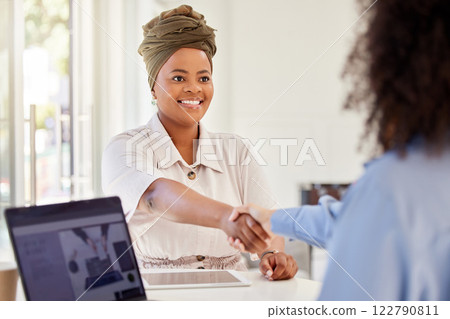 Women B2B partnership and collaboration handshake of business people in digital marketing meeting. Happy smile of woman and HR or Human Resources hiring manager shaking hands in recruitment interview Women B2B partnership and collaboration handshake of business people in digital marketing meeting. Happy smile of woman and HR or Human Resources hiring manager shaking hands in recruitment interview 122790811